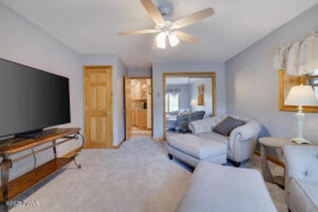 7 Shore Line Dr, Lakeville, PA 18438 - living room with ceiling fan and carpet flooring