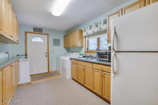 7 Shore Line Dr, Lakeville, PA 18438 - kitchen with freestanding refrigerator and light countertops