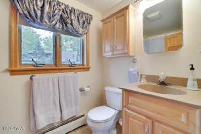 7 Shore Line Dr, Lakeville, PA 18438 - bathroom featuring a chandelier, toilet, vanity, and a baseboard heating unit