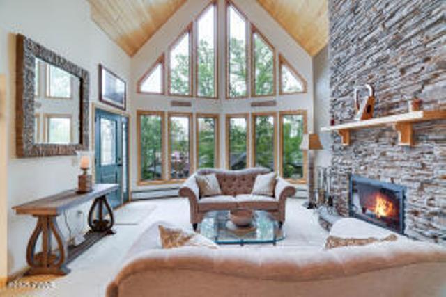 7 Shore Line Dr, Lakeville, PA 18438 - living area featuring high vaulted ceiling, a fireplace, and wooden ceiling
