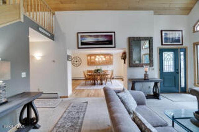 7 Shore Line Dr, Lakeville, PA 18438 - living area with wooden ceiling, plenty of natural light, a high ceiling, and wood finished floors