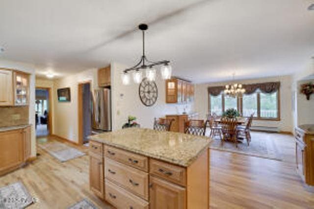 7 Shore Line Dr, Lakeville, PA 18438 - kitchen featuring light wood-type flooring, refrigerator, a chandelier, a center island, and hanging light fixtures