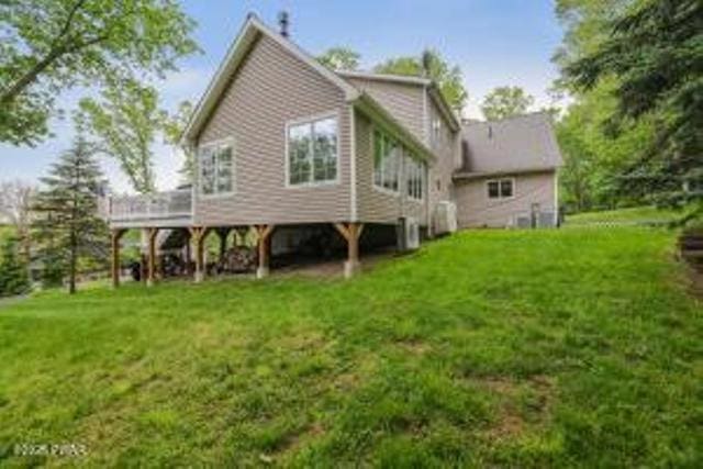 7 Shore Line Dr, Lakeville, PA 18438 - back of house featuring a wooden deck and a yard