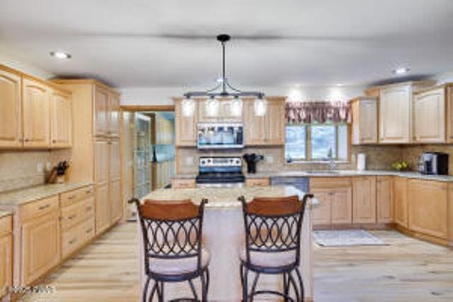 7 Shore Line Dr, Lakeville, PA 18438 - kitchen featuring appliances with stainless steel finishes, light wood-style flooring, light brown cabinets, light countertops, and recessed lighting