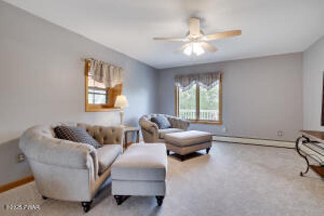 7 Shore Line Dr, Lakeville, PA 18438 - living area featuring a ceiling fan, baseboards, and carpet flooring