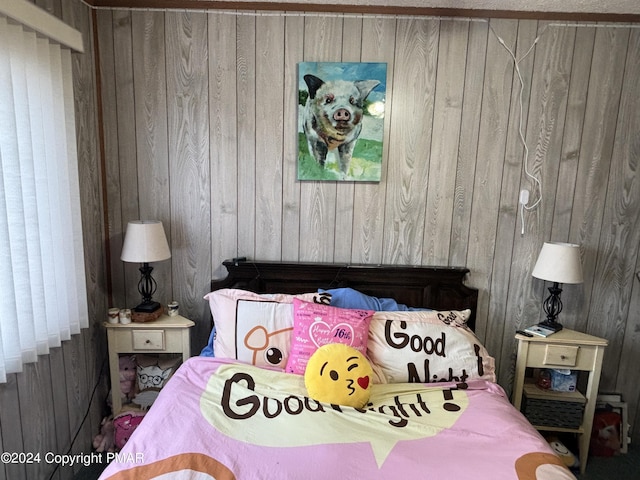 bedroom featuring wood walls