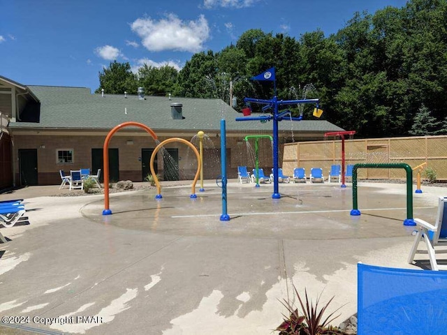 community play area featuring fence