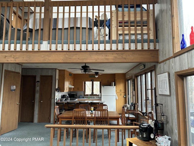 dining room featuring carpet and a ceiling fan