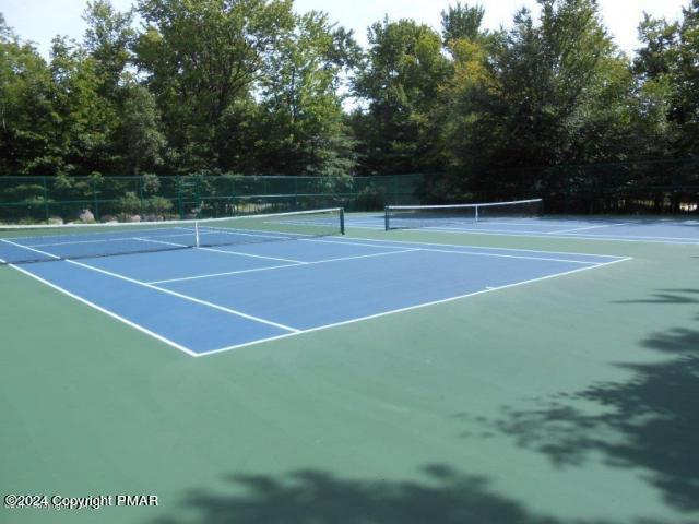 view of sport court with fence