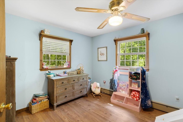 114 Gregory Ct, Stroudsburg, PA 18360 - bedroom featuring a baseboard radiator, multiple windows, and light wood-style floors