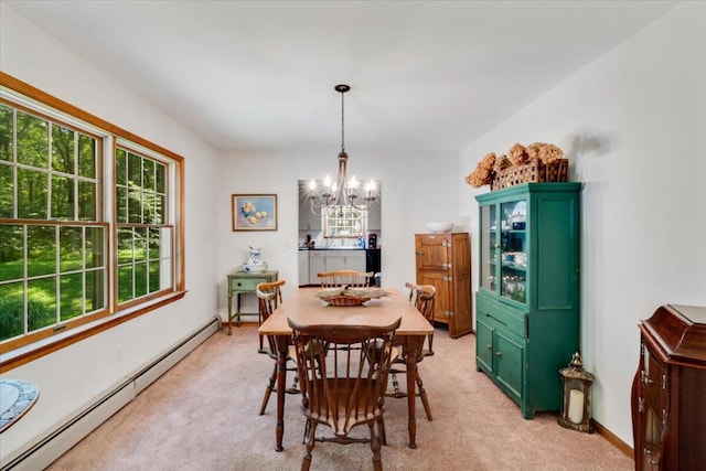 114 Gregory Ct, Stroudsburg, PA 18360 - dining space with baseboard heating, a chandelier, and light colored carpet