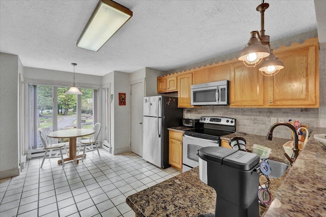 1055 Crestwoods Dr, Pocono Pines, PA 18350 - kitchen with appliances with stainless steel finishes, tasteful backsplash, light tile patterned flooring, a textured ceiling, and a baseboard heating unit