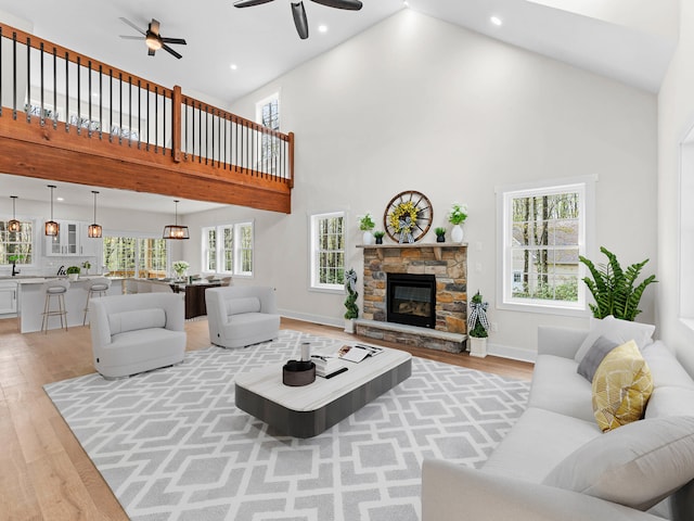 26 Susquehanna Dr, Jim Thorpe, PA 18229 - living room featuring high vaulted ceiling, ceiling fan, light wood-style floors, healthy amount of natural light, and recessed lighting