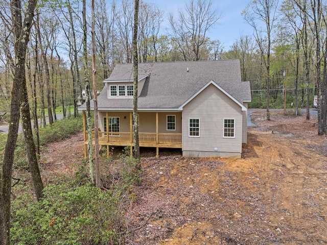 26 Susquehanna Dr, Jim Thorpe, PA 18229 - back of property with a shingled roof and covered porch