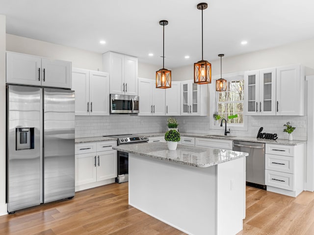 26 Susquehanna Dr, Jim Thorpe, PA 18229 - kitchen featuring stainless steel appliances, tasteful backsplash, glass insert cabinets, white cabinetry, and recessed lighting
