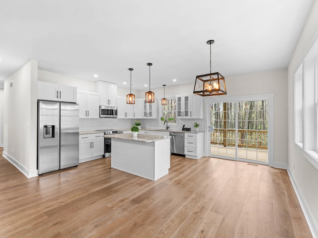 26 Susquehanna Dr, Jim Thorpe, PA 18229 - kitchen featuring stainless steel appliances, plenty of natural light, tasteful backsplash, white cabinetry, and recessed lighting