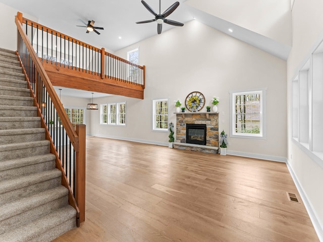 26 Susquehanna Dr, Jim Thorpe, PA 18229 - unfurnished living room featuring high vaulted ceiling, ceiling fan, stairs, plenty of natural light, and recessed lighting