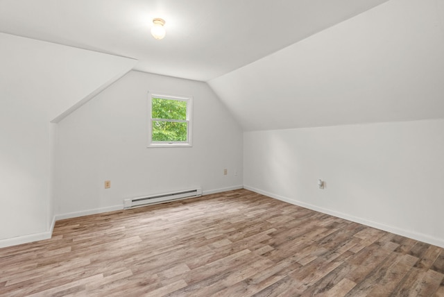 1221 Alder Rd, East Stroudsburg, PA 18302 - additional living space with baseboard heating, light wood-style floors, vaulted ceiling, and baseboards