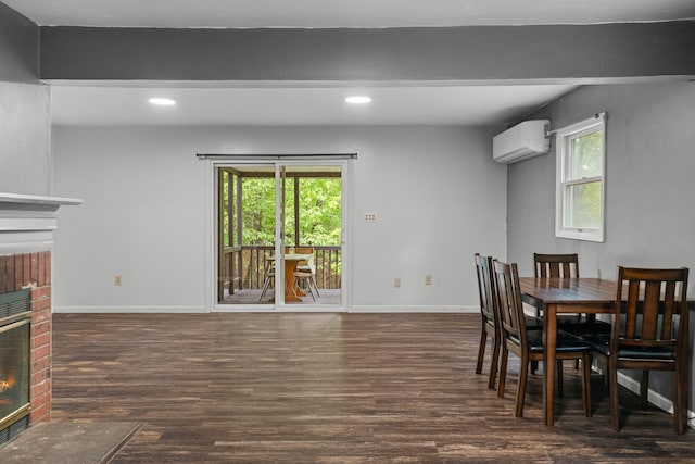1221 Alder Rd, East Stroudsburg, PA 18302 - dining space with a fireplace, a wall mounted air conditioner, wood finished floors, recessed lighting, and baseboards