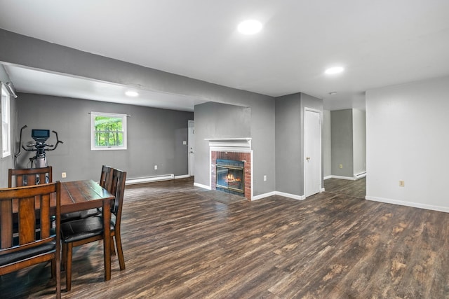 1221 Alder Rd, East Stroudsburg, PA 18302 - dining space featuring a baseboard heating unit, wood finished floors, baseboards, recessed lighting, and a fireplace