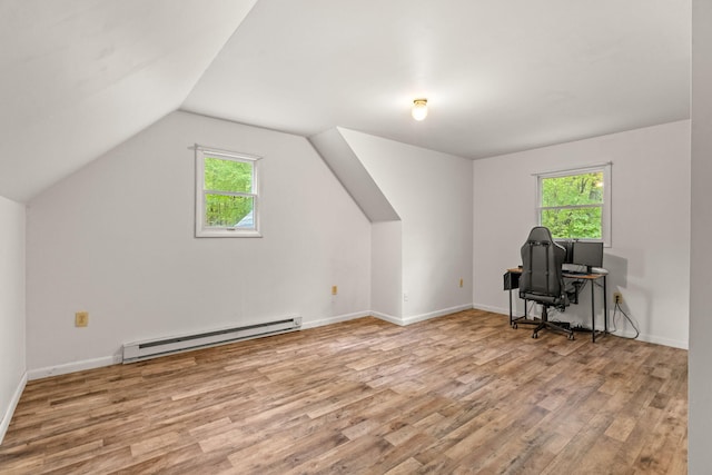 1221 Alder Rd, East Stroudsburg, PA 18302 - unfurnished office with a baseboard heating unit, wood finished floors, healthy amount of natural light, vaulted ceiling, and baseboards