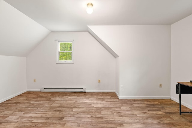 1221 Alder Rd, East Stroudsburg, PA 18302 - bonus room with a baseboard heating unit, light wood-style floors, vaulted ceiling, and baseboards
