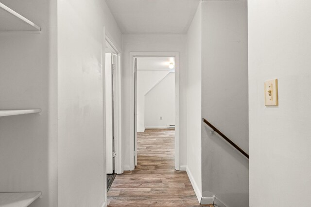 1221 Alder Rd, East Stroudsburg, PA 18302 - hallway featuring an upstairs landing, wood finished floors, and a baseboard radiator