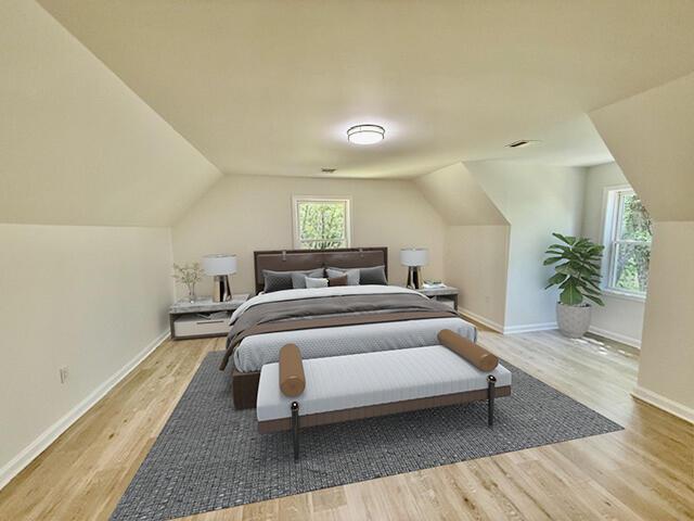 459 Pocono Blvd, Bushkill, PA 18324 - bedroom with lofted ceiling, wood finished floors, and multiple windows