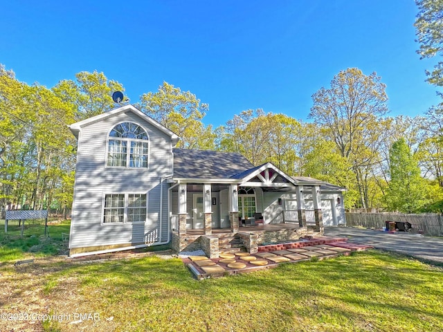158 Davis Cir, Bushkill, PA 18324 - back of property with covered porch, driveway, and a garage