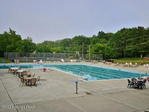 158 Davis Cir, Bushkill, PA 18324 - community pool with a patio area and a view of trees