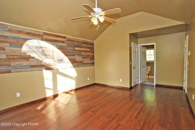 158 Davis Cir, Bushkill, PA 18324 - unfurnished room with a ceiling fan, lofted ceiling, wood finished floors, wallpapered walls, and an accent wall