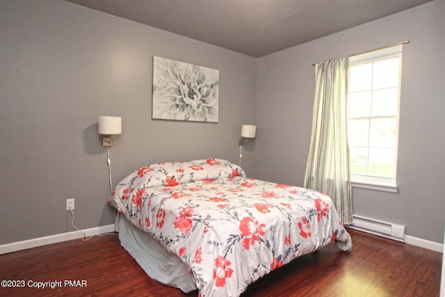 158 Davis Cir, Bushkill, PA 18324 - bedroom featuring a baseboard radiator, multiple windows, and wood finished floors