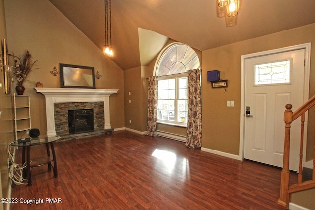 158 Davis Cir, Bushkill, PA 18324 - foyer entrance featuring a baseboard radiator, wood finished floors, a fireplace, lofted ceiling, and stairs