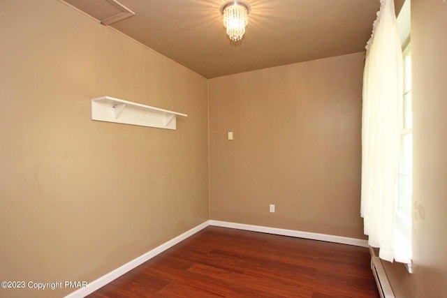 158 Davis Cir, Bushkill, PA 18324 - empty room featuring dark wood-style floors and a baseboard heating unit