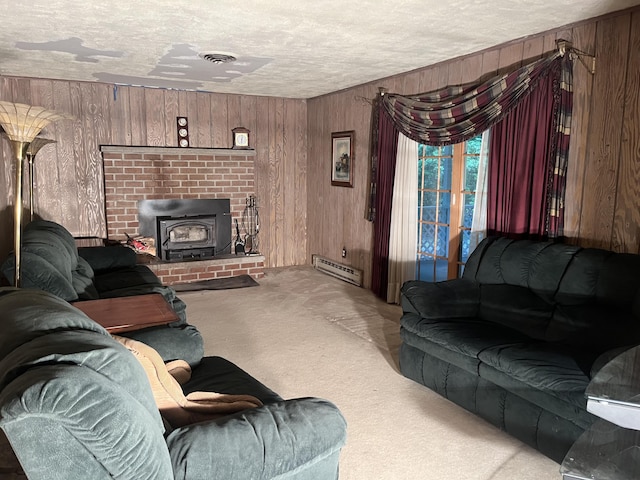 122 Savage Trl, East Stroudsburg, PA 18301 - carpeted living area featuring wood walls, a wood stove, baseboard heating, and a textured ceiling