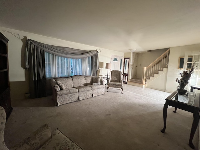 122 Savage Trl, East Stroudsburg, PA 18301 - carpeted living area featuring stairway and tile patterned floors