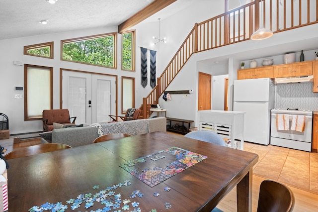 130 Ruffed Grouse Rd, Bushkill, PA 18324 - dining space with high vaulted ceiling, stairs, a baseboard heating unit, beamed ceiling, and light tile patterned floors