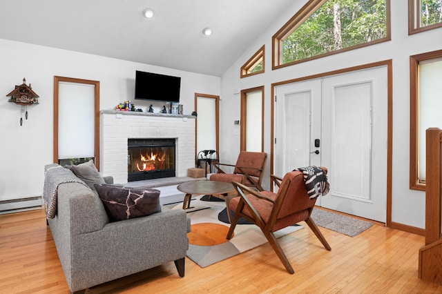 130 Ruffed Grouse Rd, Bushkill, PA 18324 - living area featuring a fireplace, light wood-type flooring, high vaulted ceiling, healthy amount of natural light, and recessed lighting