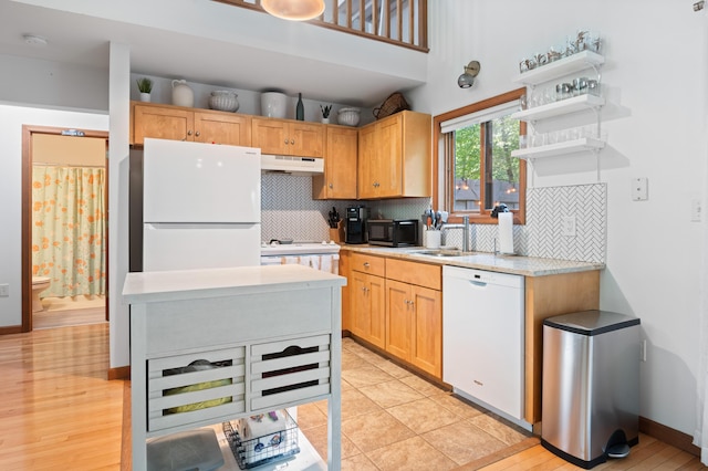 130 Ruffed Grouse Rd, Bushkill, PA 18324 - kitchen featuring white appliances, under cabinet range hood, light countertops, backsplash, and open shelves