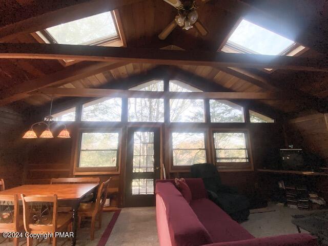 2086 Glenwood Ln, Lake Ariel, PA 18436 - living room featuring vaulted ceiling with skylight, a ceiling fan, and a wealth of natural light