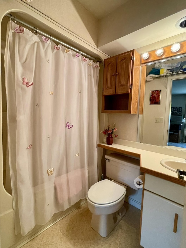 full bathroom featuring toilet, vanity, and shower / bathtub combination with curtain