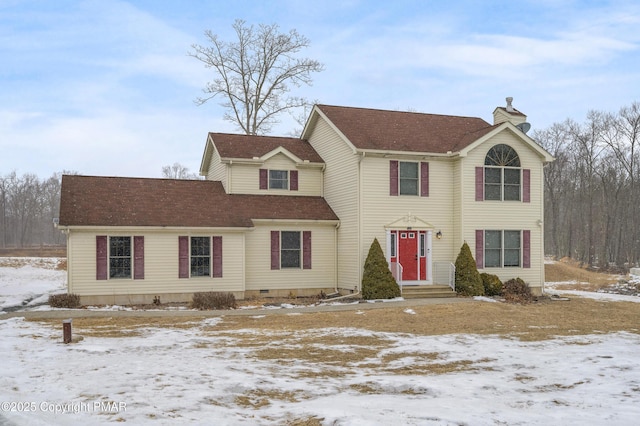 view of front of house featuring a chimney