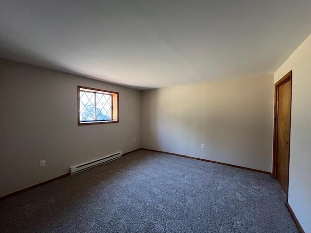 unfurnished room with carpet flooring, baseboards, and a baseboard radiator