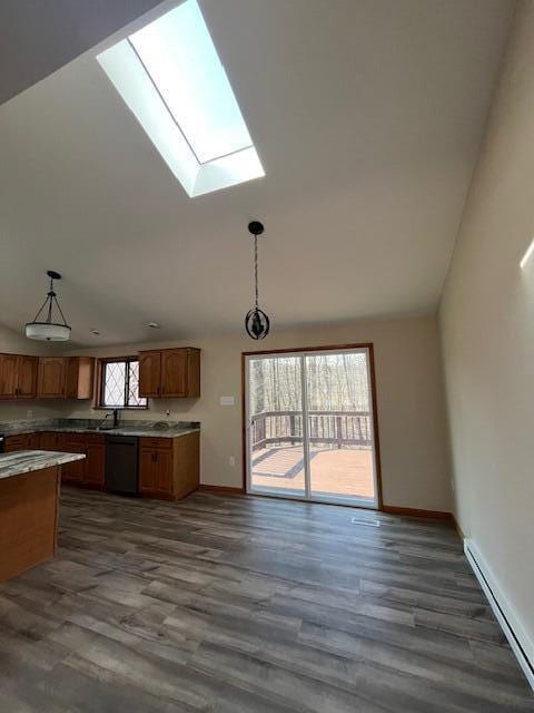 kitchen with a baseboard heating unit, dark wood finished floors, dishwasher, brown cabinets, and hanging light fixtures