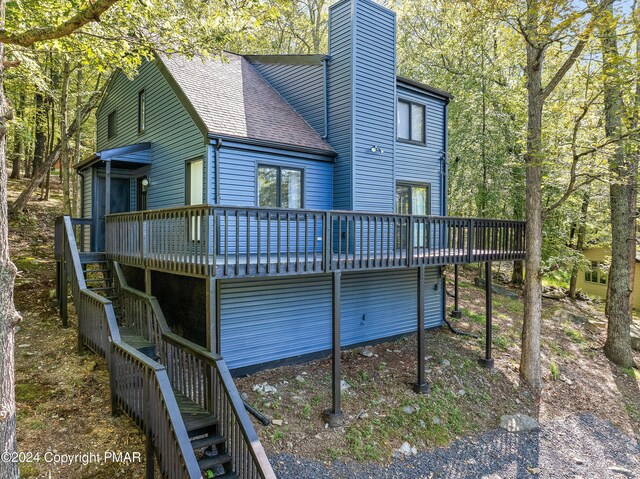 rear view of property with a deck