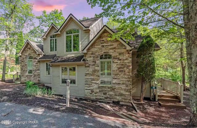 exterior space featuring stone siding