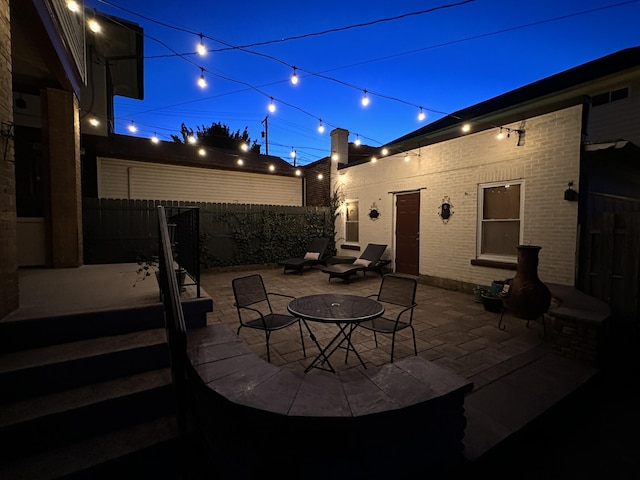 patio at night with fence