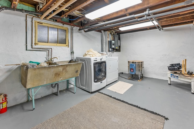 unfinished below grade area with independent washer and dryer and electric panel