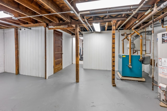 unfinished below grade area with a heating unit and water heater