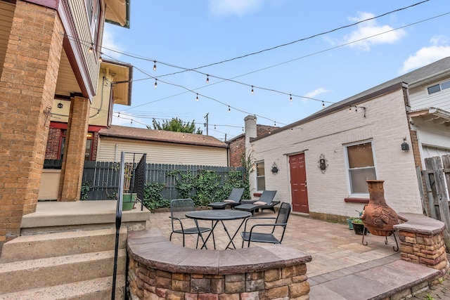 view of patio / terrace featuring fence